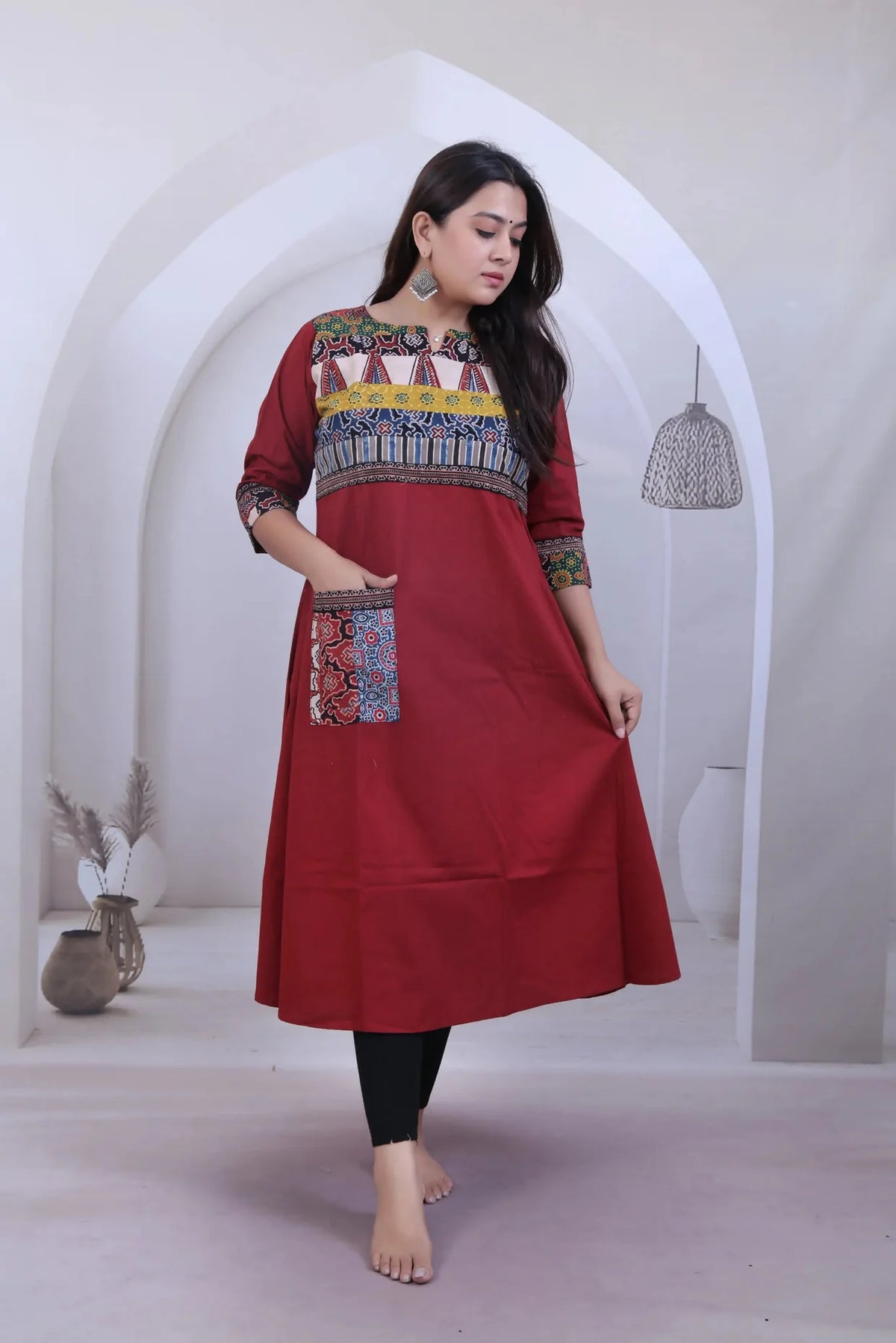 Saanvi Maroon Ajarakh Neck & Pocket A line Kurti